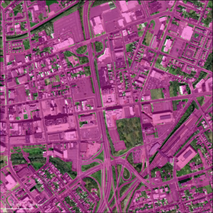 Aerial image of impervious surfaces including roads, parking lots, and buildings highlighted in magenta.