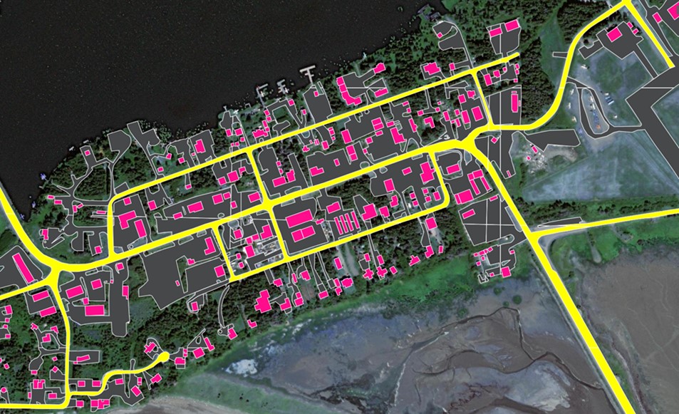 Aerial view with yellow lines over roads, pink boxes over buildings, and gray shapes over other areas.