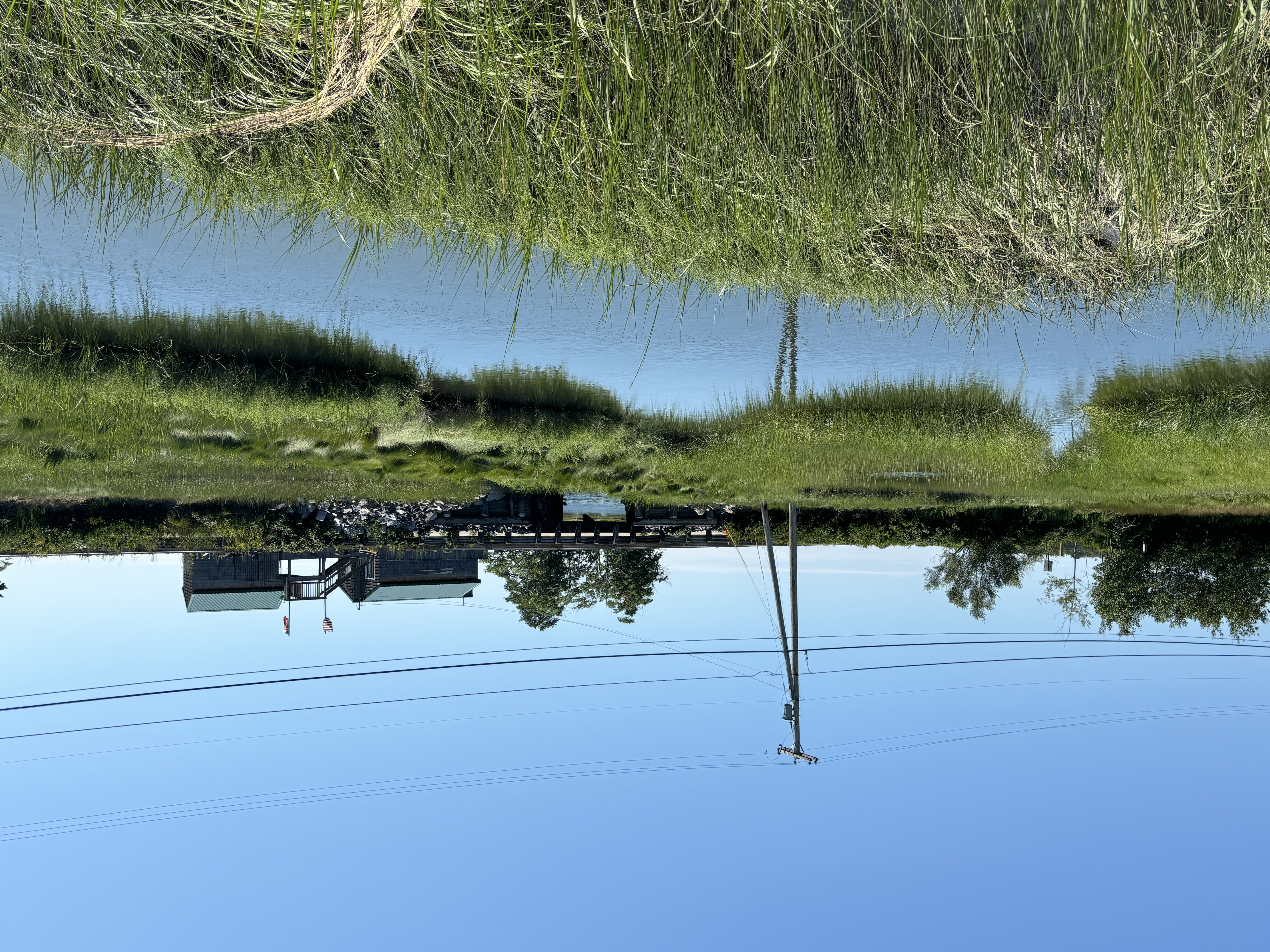 A road crosses over a small inlet into the salt marsh.