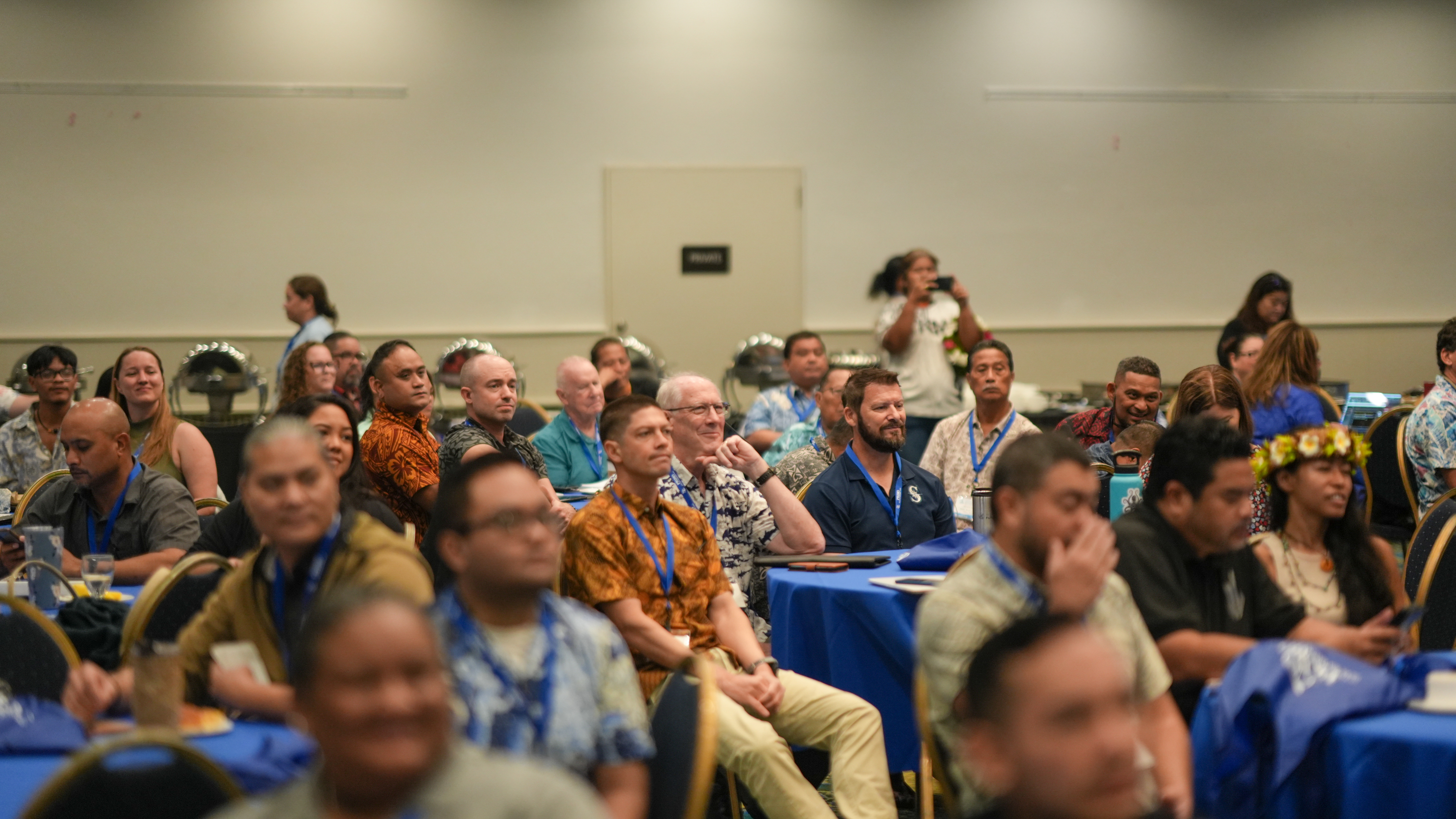 A group of people at a conference