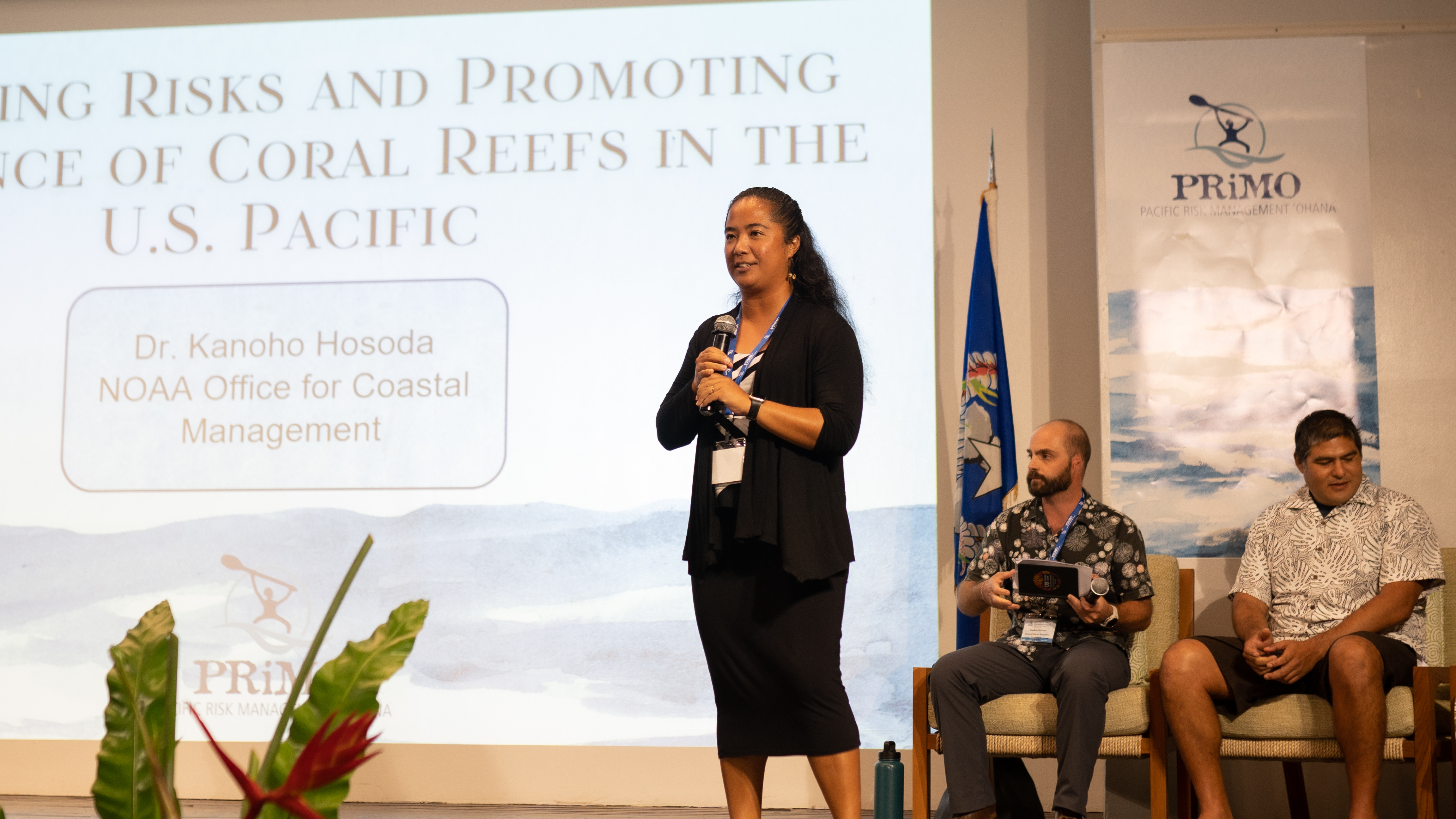 A speaker presenting at a conference